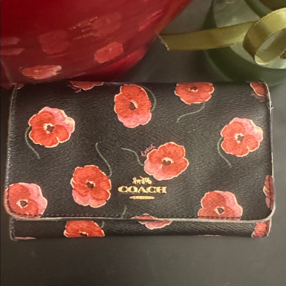 COACH bifold wallet with cute poppy print. Change pocket in back. Snap closure. - Picture 2 of 16